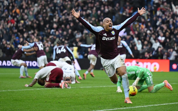 BIRMINGHAM, ENGLAND - DECEMBER 06: Donyell Malen of Aston Villa celebrates his team's second goal scored by teammate Emi Buendia (not pictured) as ...