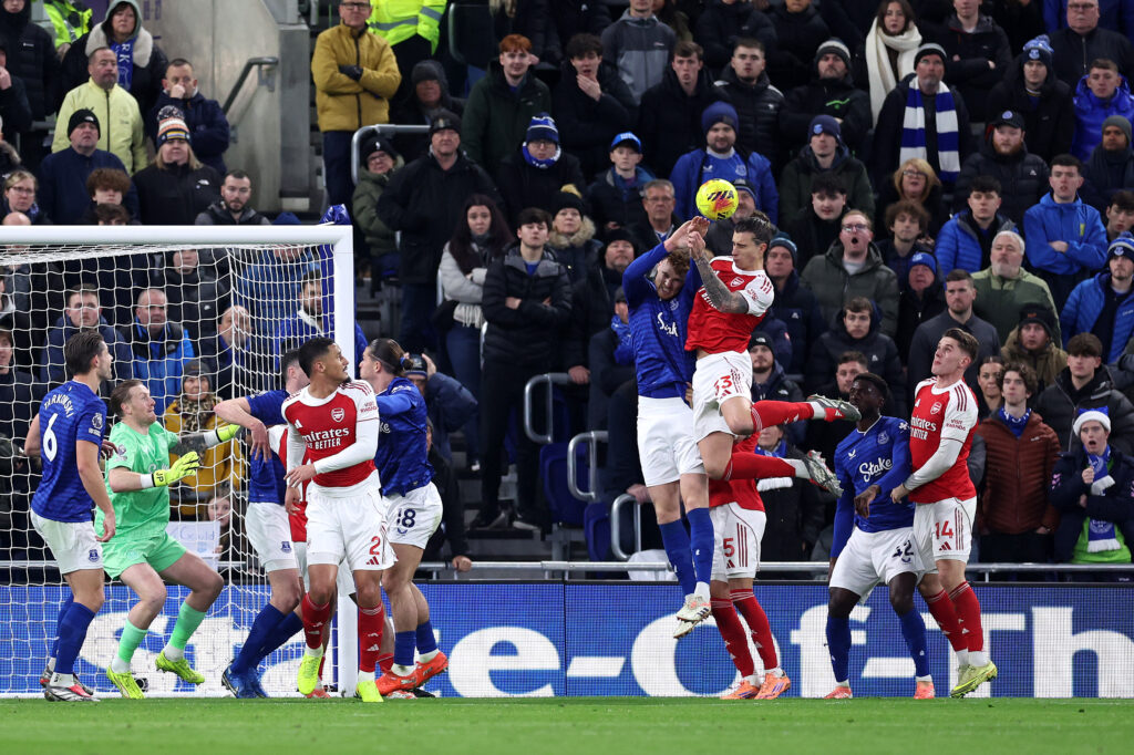 LIVERPOOL, ENGLAND - DECEMBER 20: Jake O'Brien of Everton battles for an aerial ball against Riccardo Calafiori of Arsenal, which results in a hand ball and penalty to Arsenal, during the Premier League match between Everton and Arsenal at Hill Dickinson Stadium on December 20, 2025 in Liverpool, England. (Photo by Alex Livesey/Getty Images)
