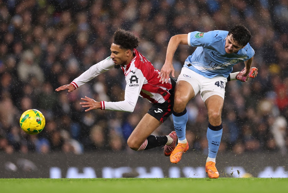 Brentford boss insists Manchester City deserved red card 2 MANCHESTER, ENGLAND: Kevin Schade of Brentford is fouled by Abdukodir Khusanov of Manchester City during the Carabao Cup Quarter Final match between Manchester City and Brentford at Etihad Stadium on December 17, 2025. (Photo by Dan Mullan/Getty Images)