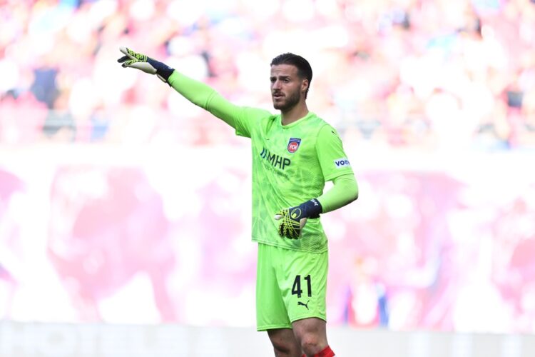 LEIPZIG, GERMANY: Diant Ramaj of 1. FC Heidenheim reacts during the Bundesliga match between RB Leipzig and 1. FC Heidenheim 1846 at Red Bull Arena...