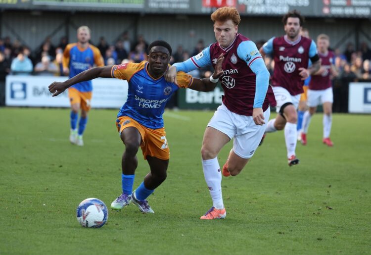 SOUTH SHIELDS, ENGLAND: Luke Woolston (R) of South Shields in action with Ismeal Kabia of Shrewsbury Town during the Emirates FA Cup First Round ma...