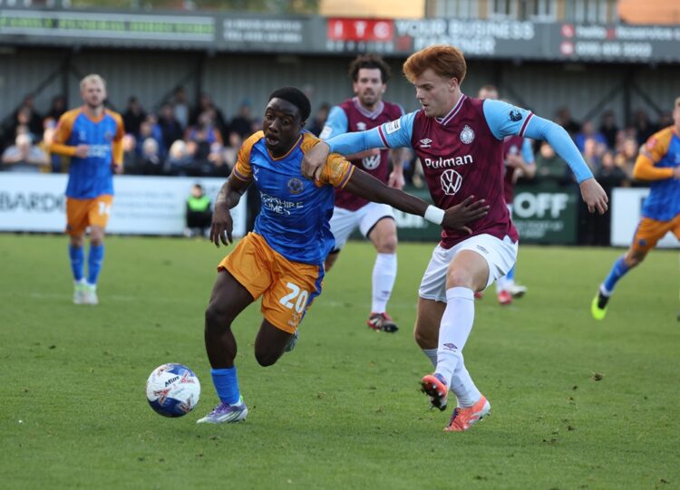 SOUTH SHIELDS, ENGLAND: Luke Woolston (R) of South Shields in action with Ismeal Kabia of Shrewsbury Town during the Emirates FA Cup First Round ma...
