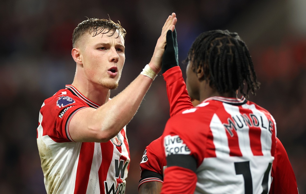 Dan Ballard of Sunderland congratulates Romaine Mundleduring the Premier League match between Sunderland and Newcastle United at Stadium of Light on December 14, 2025 in Sunderland, England. (Photo by Stu Forster/Getty Images)