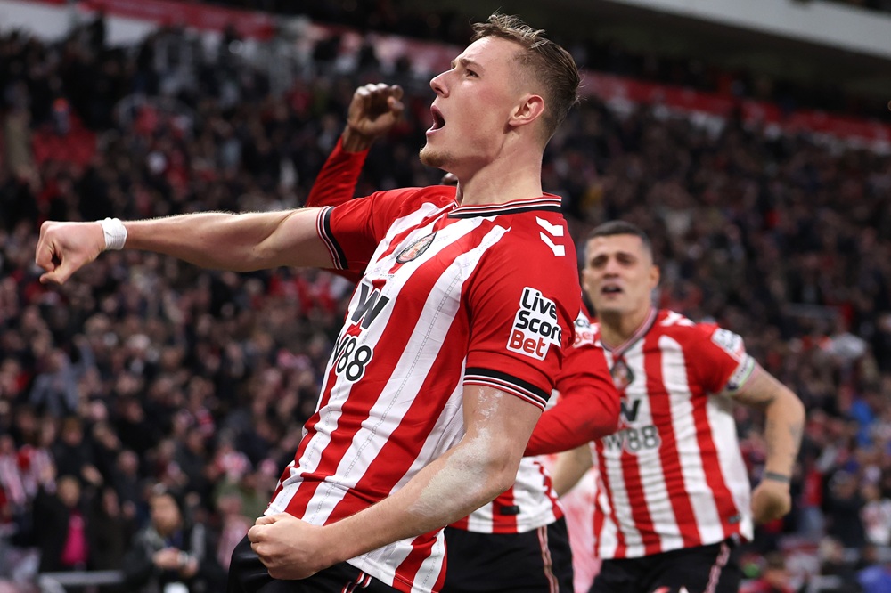 Daniel Ballard of Sunderland celebrates the teams first goal, an own goal, conceded by Nick Woltemade of Newcastle United (not pictured) during the Premier League match between Sunderland and Newcastle United at Stadium of Light on December 14, 2025 in Sunderland, England. (Photo by Carl Recine/Getty Images)