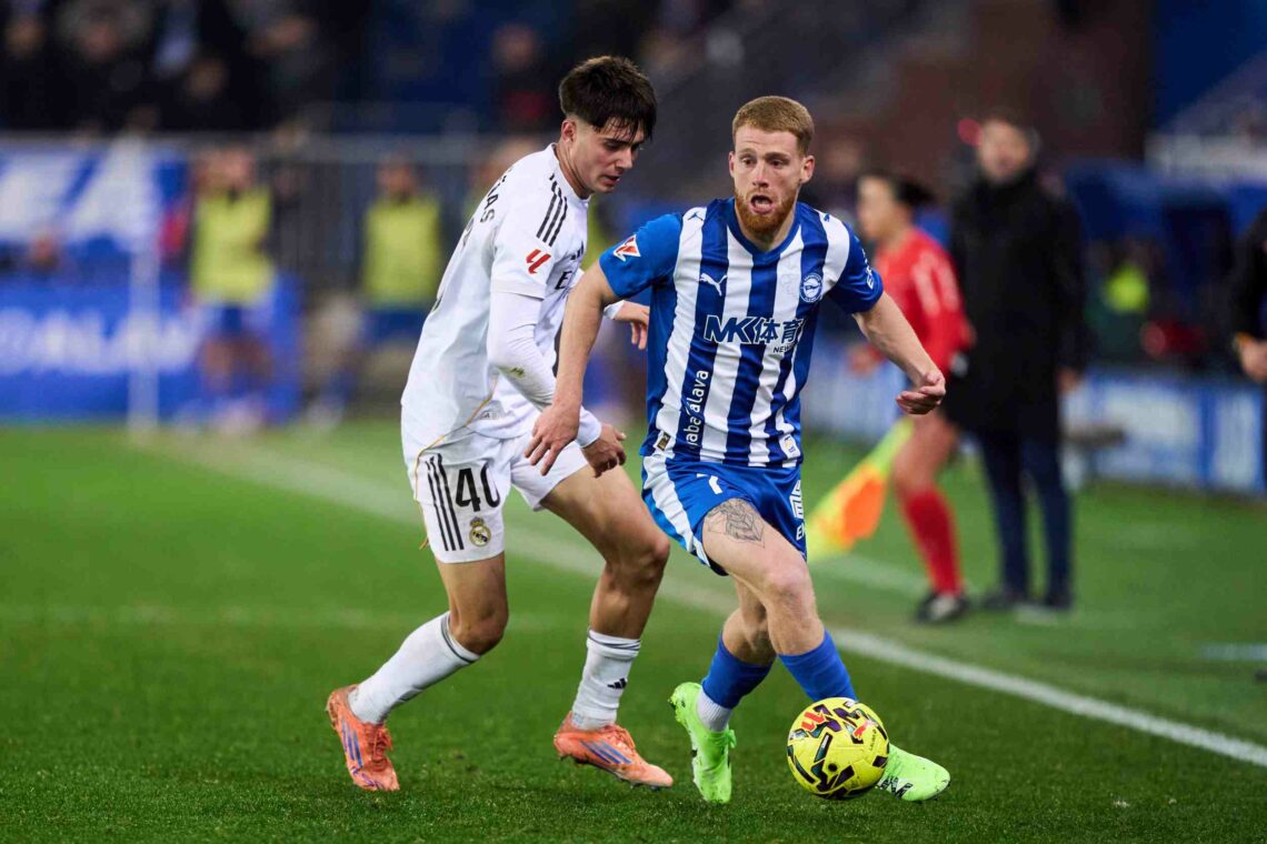 Victor Valdepenas of Real Madrid duels for the ball with Carlos Vicente of Deportivo Alaves during the LaLiga EA Sports match between Deportivo Ala...