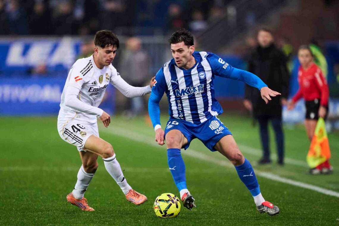 Victor Valdepenas of Real Madrid duels for the ball with Lucas Boye of Deportivo Alaves during the LaLiga EA Sports match between Deportivo Alaves ...
