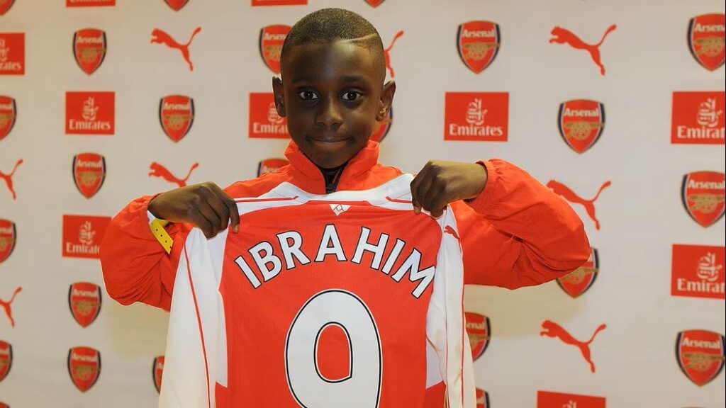 Ife Ibrahim signing for Arsenal as a young player (Photo via Arsenal.com)