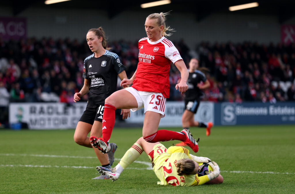BOREHAMWOOD, ENGLAND - JANUARY 18: Ellie Roebuck of Aston Villa gathers the ball from the feet of Stina Blackstenius of Arsenal during the Adobe Women's FA Cup Fourth Round match between Arsenal and Aston Villa at Mangata Pay UK Stadium on January 18, 2026 in Borehamwood, England. (Photo by Ryan Pierse/Getty Images)