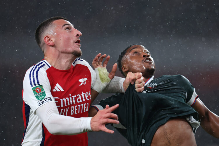 LONDON, ENGLAND - SEPTEMBER 25: Maldini Kacurri of Arsenal grabs the shirt of Victor Adeboyejo of Bolton Wanderers during the Carabao Cup Third Rou...