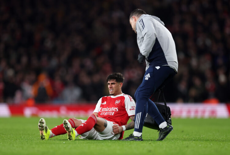 LONDON, ENGLAND - JANUARY 08: Piero Hincapie of Arsenal receives medical treatment during the Premier League match between Arsenal and Liverpool at...