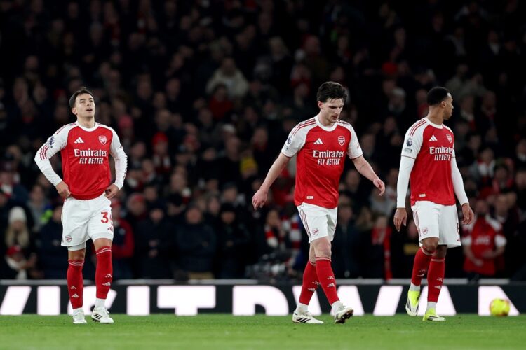Martin Zubimendi, Declan Rice and Gabriel of Arsenal react after Bryan Mbeumo of Manchester United (not pictured) scores his team's first goal duri...