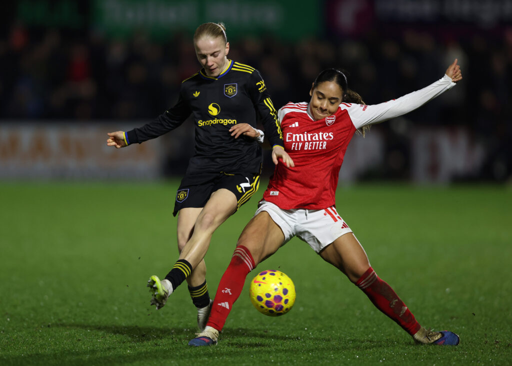 BOREHAMWOOD, ENGLAND - JANUARY 21: Olivia Smith of Arsenal battles for possession with Anna Sandberg of Manchester United during the Subway Women's League Cup Semi Final match between Arsenal and Manchester United at Mangata Pay UK Stadium on January 21, 2026 in Borehamwood, England. (Photo by Paul Harding/Getty Images)