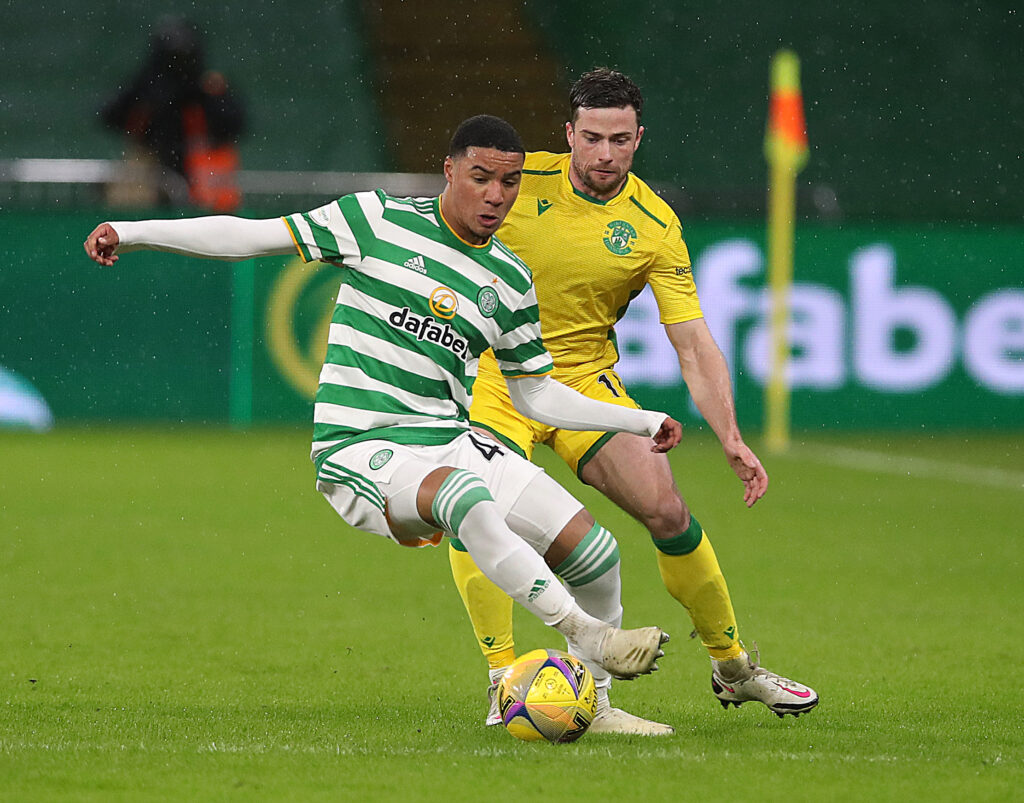 GLASGOW, SCOTLAND - JANUARY 11: Armstrong Okoflex of Celtic vies with Lewis Stevenson of Hibernian during the Ladbrokes Scottish Premiership match between Celtic and Hibernian at Celtic Park on January 11, 2021 in Glasgow, Scotland. Sporting stadiums around Scotland remain under strict restrictions due to the Coronavirus Pandemic as Government social distancing laws prohibit fans inside venues resulting in games being played behind closed doors. (Photo by Ian MacNicol/Getty Images)