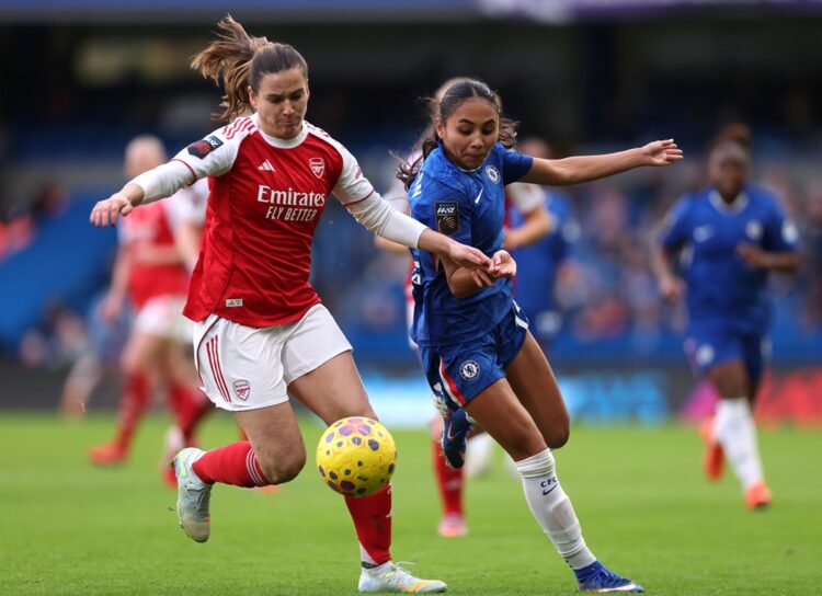 Laia Codina of Arsenal is challenged by Alyssa Thompson of Chelsea during the Barclays Women's Super League match between Chelsea FC and Arsenal at...