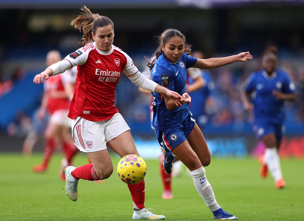 Laia Codina of Arsenal is challenged by Alyssa Thompson of Chelsea during the Barclays Women's Super League match between Chelsea FC and Arsenal at...