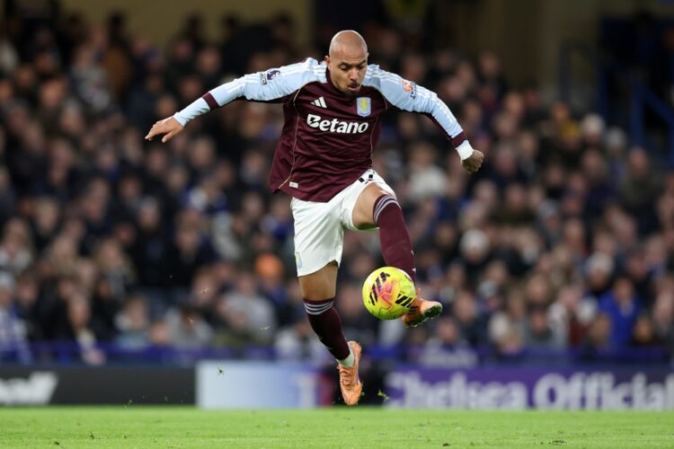 Donyell Malen of Aston Villa controls the ball during the Premier League match between Chelsea and Aston Villa at Stamford Bridge on December 27, 2...