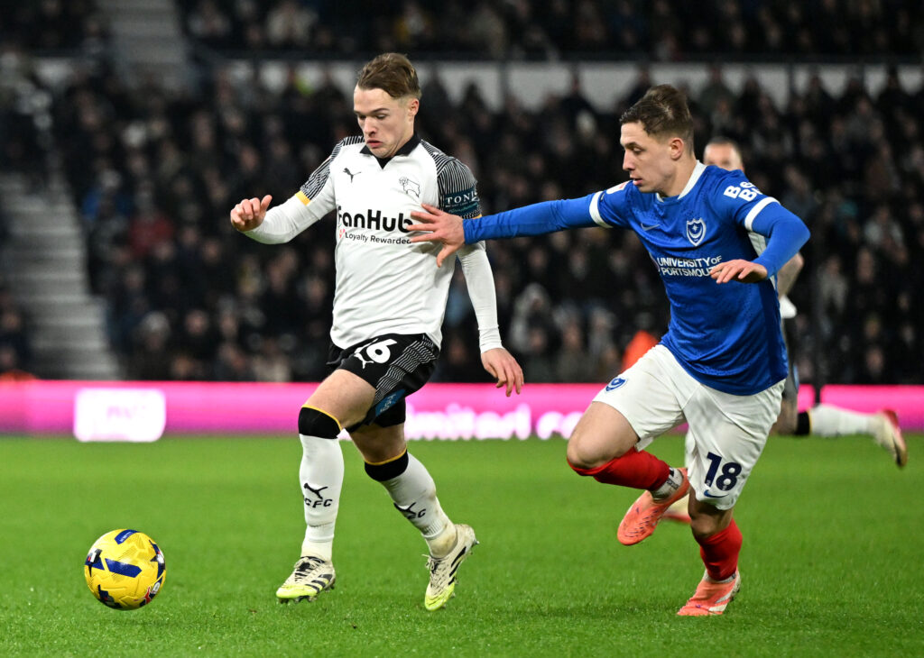 DERBY, ENGLAND - DECEMBER 20: Liam Thompson of Derby County is challenged by Mark Kosznovszky of Portsmouth during the Sky Bet Championship match between Derby County and Portsmouth at Pride Park on December 20, 2025 in Derby, England. (Photo by Mark Sutton/Getty Images)