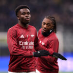 MILAN, ITALY - JANUARY 20: Bukayo Saka of Arsenal warms up prior to the UEFA Champions League 2025/26 League Phase MD7 match between FC Internazionale Milano and Arsenal FC at Stadio San Siro on January 20, 2026 in Milan, Italy. (Photo by Carl Recine/Getty Images)