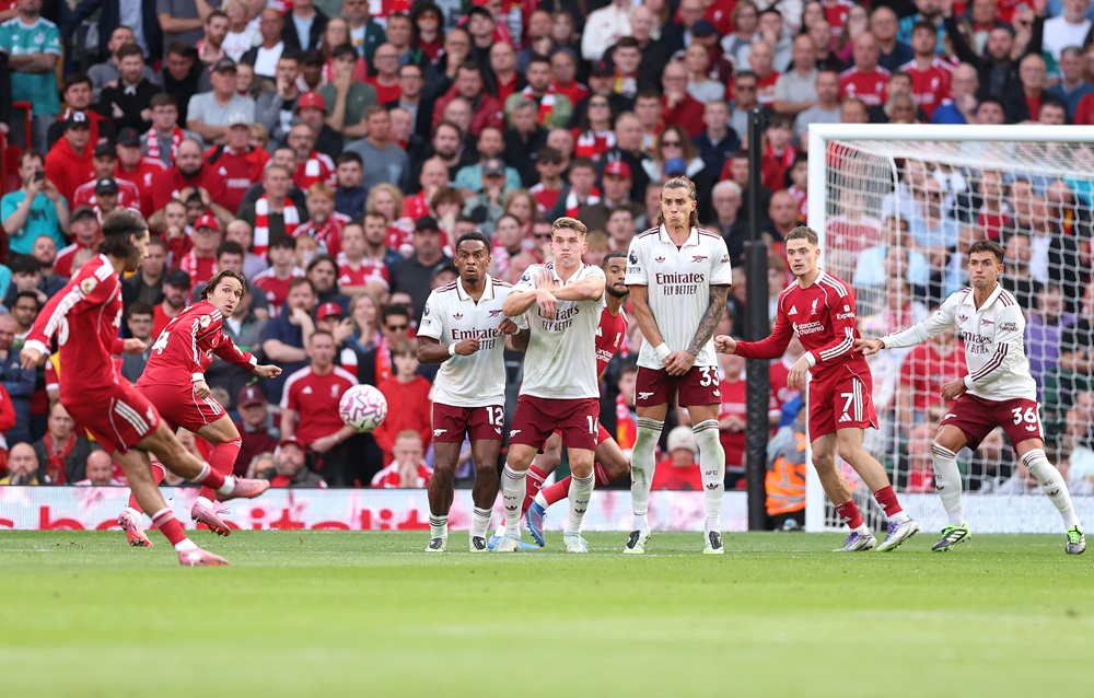 Dominik Szoboszlai of Liverpool scores his side's first goal from a direct freekick during the Premier League match between Liverpool and Arsenal at Anfield on August 31, 2025 in Liverpool, England. (Photo by Alex Pantling/Getty Images)