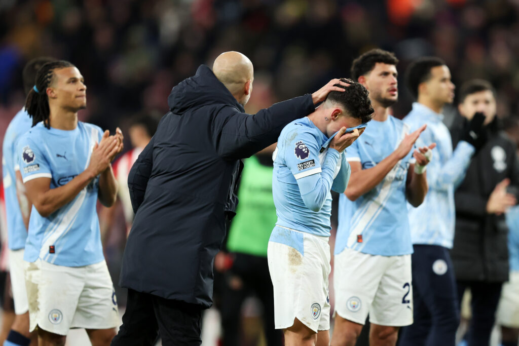 SUNDERLAND, ENGLAND - JANUARY 01: Pep Guardiola, Manager of Manchester City, consoles a dejected Phil Foden after the Premier League match between Sunderland and Manchester City at Stadium of Light on January 01, 2026 in Sunderland, England. (Photo by Matt McNulty/Getty Images)