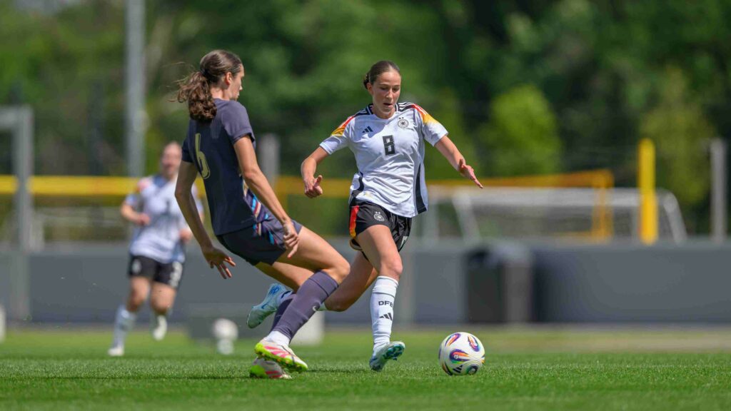FRANKFURT AM MAIN, GERMANY - MAY 30: ( Editors note: This photo has been edited in 16:9) Maj Schneider of U19 Germany challenges Cecily Wellesley-Smith of U19 England during U19 Woman's International Friendly match from U19 Germany and U19 England at DFB-Campus on May 30, 2025 in Frankfurt am Main, Germany. (Photo by Christian Kaspar-Bartke/Getty Images for DFB)