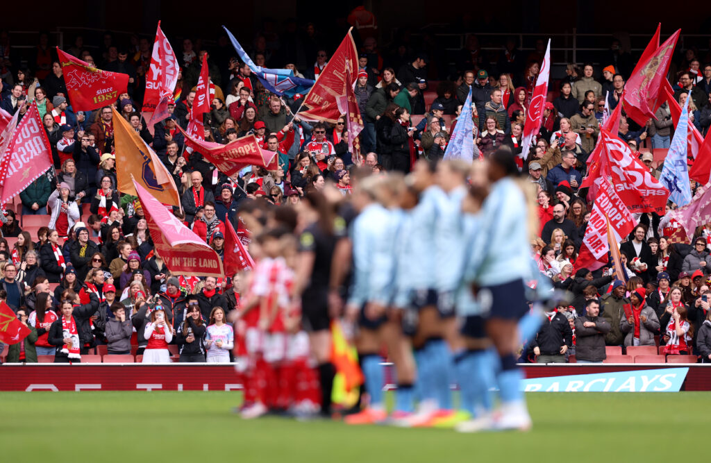 LONDON, ENGLAND - FEBRUARY 08: Arsenal fans wave flags in the stands as a show of support as the players line up prior to the Barclays Women's Super League match between Arsenal and Manchester City at Emirates Stadium on February 08, 2026 in London, England. (Photo by Harry Murphy/Getty Images)