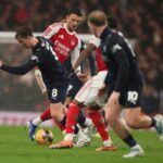 LONDON, ENGLAND: Ben White of Arsenal and Callum Wright of Wigan Athletic during the Emirates FA Cup Fourth Round match between Arsenal and Wigan Athletic on February 15, 2026. (Photo by Richard Pelham/Getty Images)
