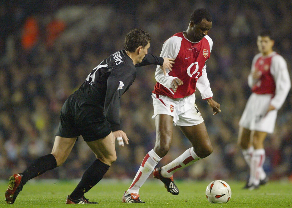 LONDON - DECEMBER 2: Keith Andrews of Wolverhampton Wanderers tries to tackle Patrick Vieira of during the Carling Cup fourth round match between Arsenal and Wolverhampton Wanderers at Highbury on December 2, 2003 in London. (Photo by Clive Mason/Getty Images)