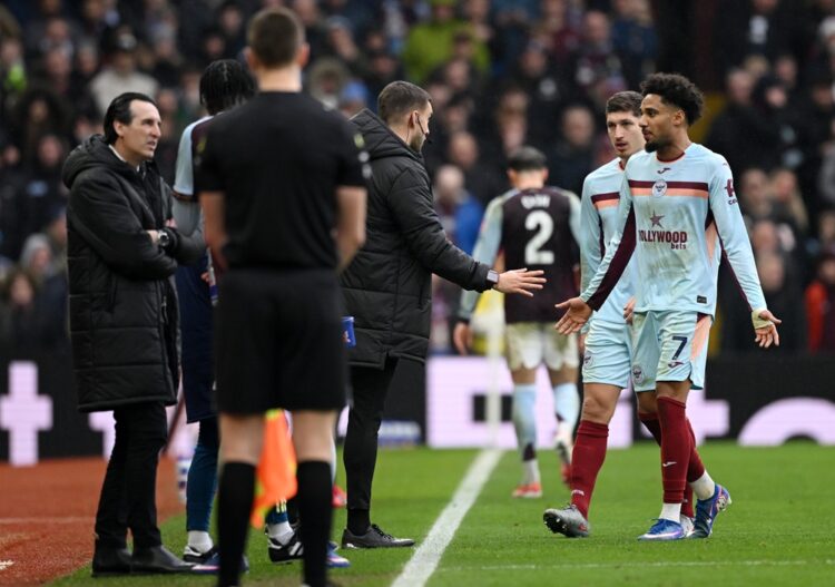 Kevin Schade of Brentford walks off the pitch after receiving a red card during the Premier League match between Aston Villa and Brentford at Villa...