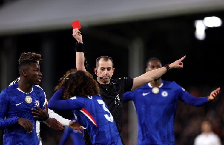 Referee Peter Bankes shows a red card to Marc Cucurella of Chelsea during the Premier League match between Fulham and Chelsea at Craven Cottage on ...