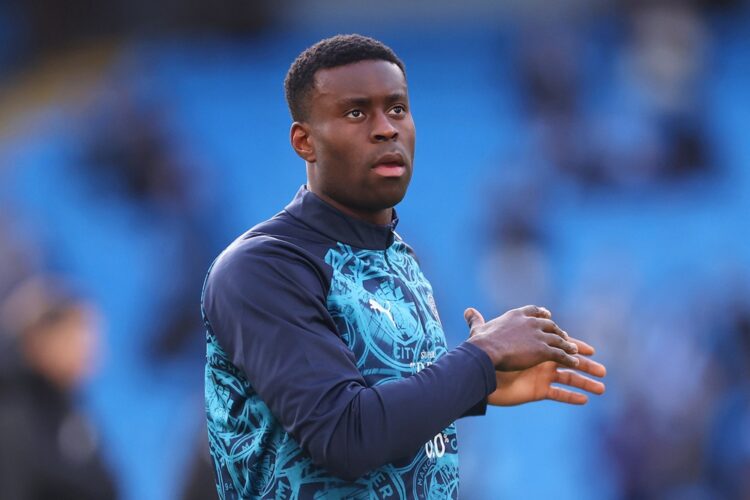 Marc Guehi of Manchester City warms up prior to the Premier League match between Manchester City and Wolverhampton Wanderers at Etihad Stadium on J...
