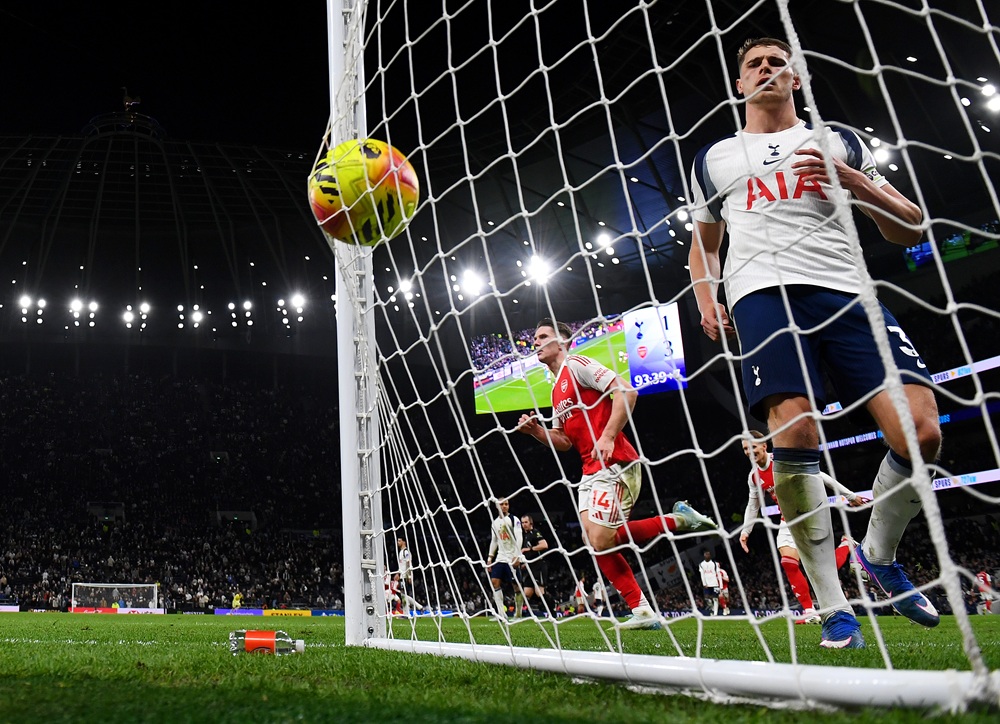 Micky van de Ven of Tottenham Hotspur reacts after Viktor Gyokeres of Arsenal scores his team's fourth goal during the Premier League match between Tottenham Hotspur and Arsenal at Tottenham Hotspur Stadium on February 22, 2026 in London, England. (Photo by Mike Hewitt/Getty Images)