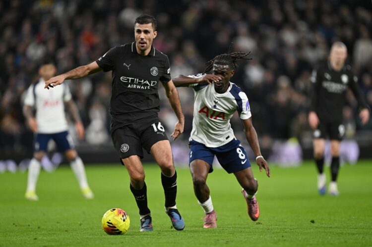 Rodri of Manchester City is challenged by Yves Bissouma of Tottenham Hotspur during the Premier League match between Tottenham Hotspur and Manchest...