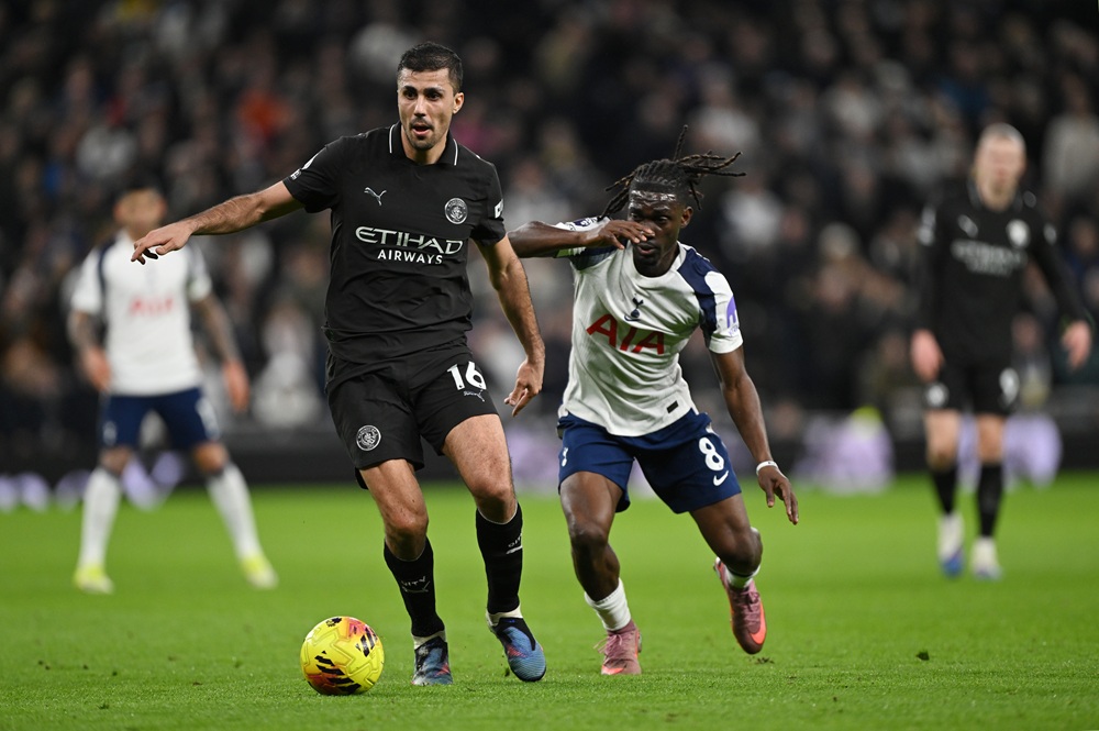 Rodri of Manchester City is challenged by Yves Bissouma of Tottenham Hotspur during the Premier League match between Tottenham Hotspur and Manchest...