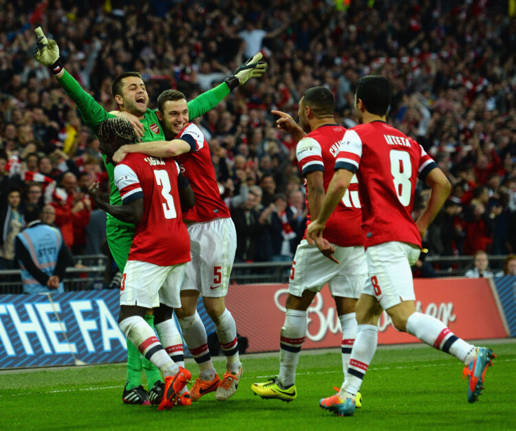 LONDON, ENGLAND - APRIL 12: Lukasz Fabianski of Arsenal celebrates winning the penalty shoot out with team mates during the FA Cup Semi-Final match...