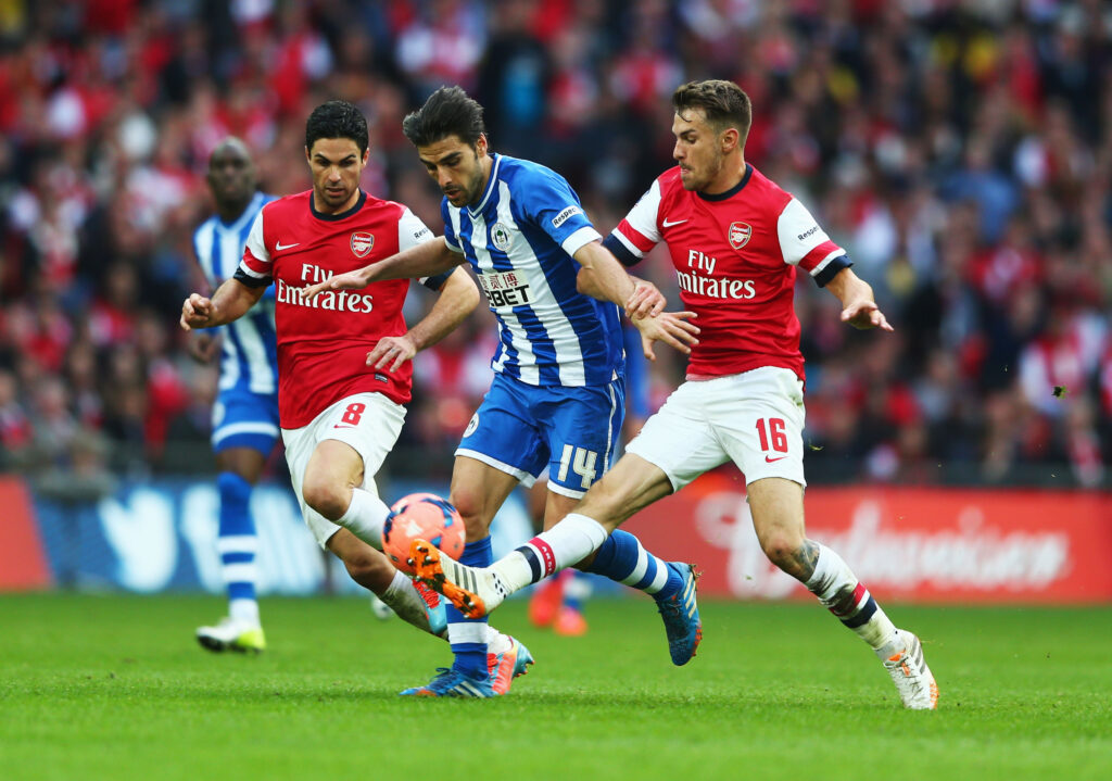 Arsenal boss issues clear demand before FA Cup tie 4 LONDON, ENGLAND - APRIL 12: Jordi Gomez of Wigan Athletic is closed down by Mikel Arteta of Arsenal and Aaron Ramsey of Arsenal during the FA Cup Semi-Final match between Wigan Athletic and Arsenal at Wembley Stadium on April 12, 2014 in London, England. (Photo by Michael Steele/Getty Images)