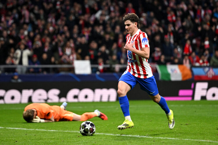 Julian Alvarez of Atletico de Madrid scores his team's third goal, as Antonin Kinsky of Tottenham Hotspur looks dejected during the UEFA Champions ...