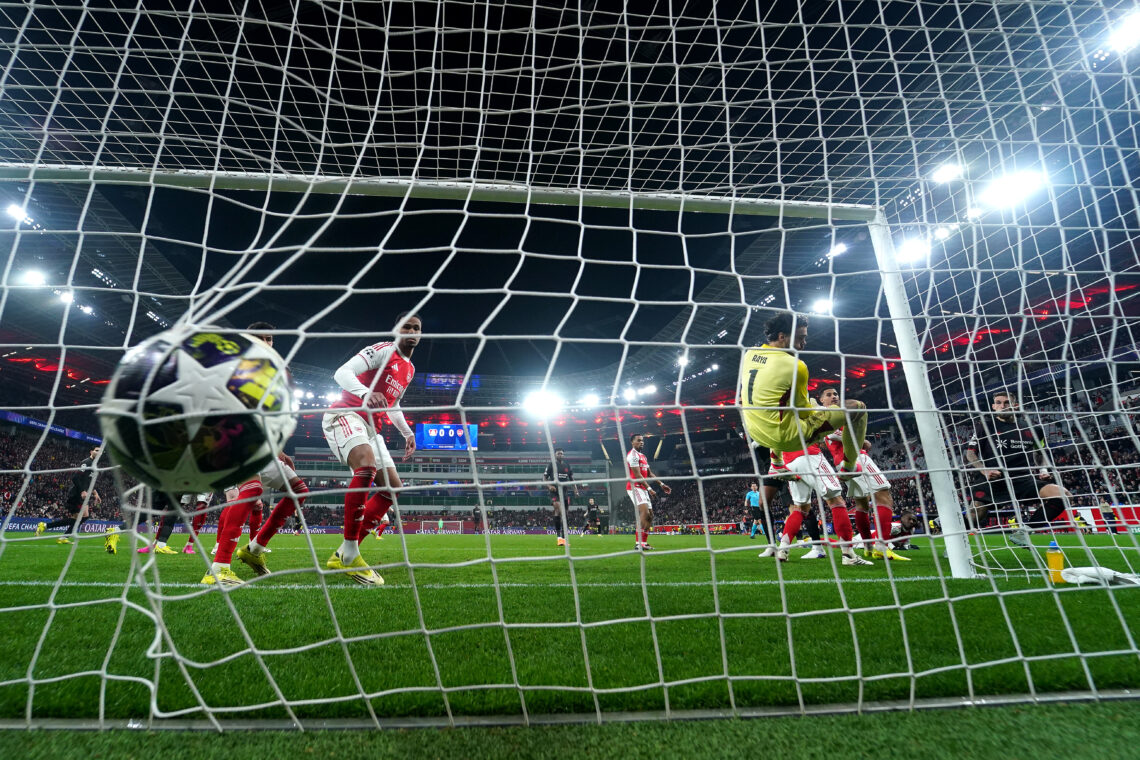 Robert Andrich of Bayer 04 Leverkusen scores his team's first goal past David Raya of Arsenal during the UEFA Champions League 2025/26 Round of 16 ...