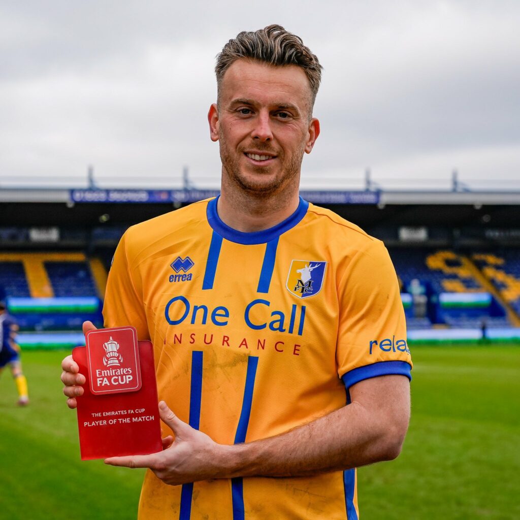 Rhys Oates with his Player of the Match award (Photo via Mansfield Town on Twitter)