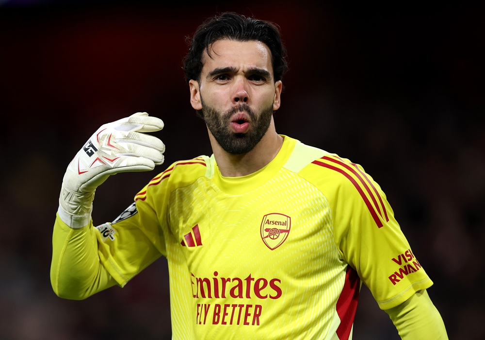 David Raya of Arsenal reacts after teammate Eberechi Eze (not pictured) scored their team's first goal during the UEFA Champions League 2025/26 Round of 16 Second Leg match between Arsenal FC and Bayer 04 Leverkusen at Arsenal Stadium on March 17, 2026 in London, England. (Photo by Justin Setterfield/Getty Images)