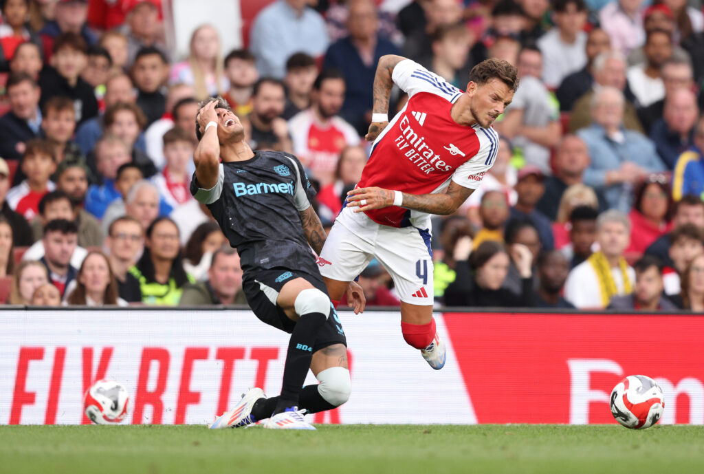 LONDON, ENGLAND - AUGUST 07: Ben White of Arsenal tackles Piero Hincapie of Bayer Leverkusen during the pre-season friendly match between Arsenal and Bayer 04 Leverkusen at Emirates Stadium on August 07, 2024 in London, England. (Photo by Warren Little/Getty Images)