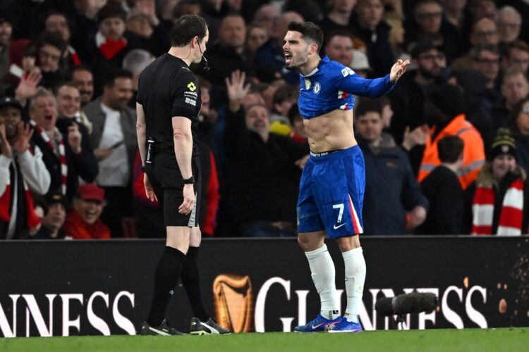 Pedro Neto of Chelsea reacts towards Referee Darren England after showing him a red card during the Premier League match between Arsenal and Chelse...