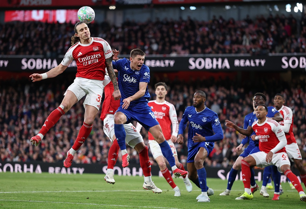 Riccardo Calafiori of Arsenal and Vitaliy Mykolenko of Everton compete for the ball in the air during the Premier League match between Arsenal and Everton at Emirates Stadium on March 14, 2026 in London, England. (Photo by Justin Setterfield/Getty Images)
