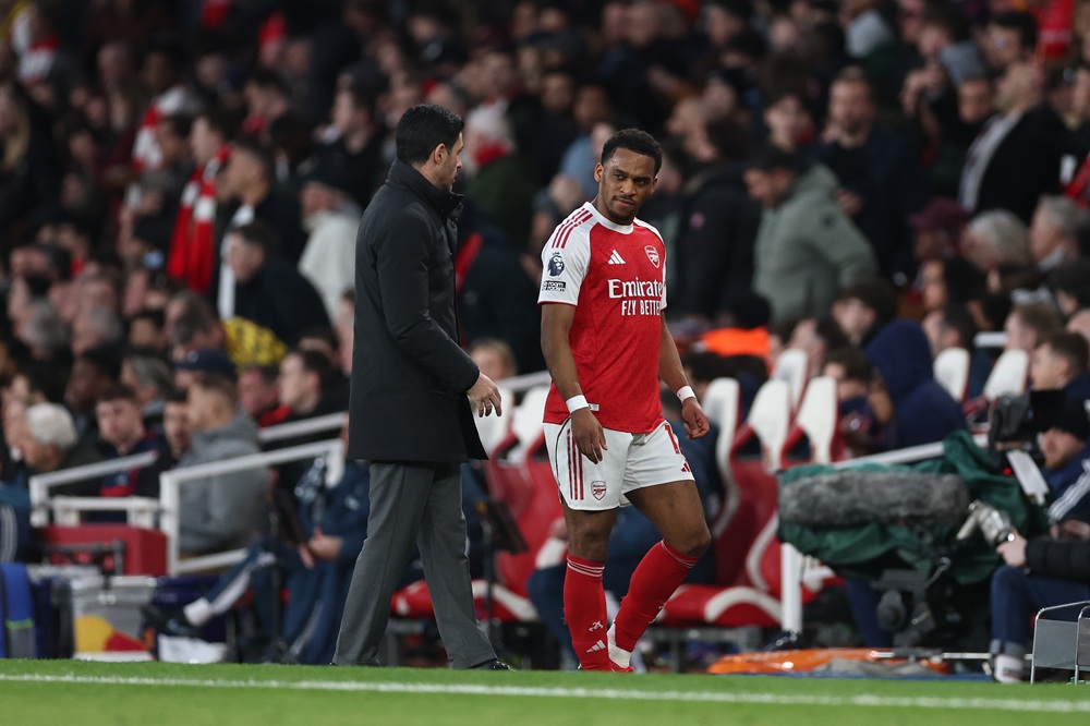 Mikel Arteta, Manager of Arsenal, interacts with Jurrien Timber of Arsenal as he is substituted during the Premier League match between Arsenal and Everton at Emirates Stadium on March 14, 2026 in London, England. (Photo by Alex Pantling/Getty Images)