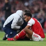 Jurrien Timber of Arsenal receives medical treatment during the Premier League match between Arsenal and Everton at Emirates Stadium on March 14, 2026 in London, England. (Photo by Alex Pantling/Getty Images)