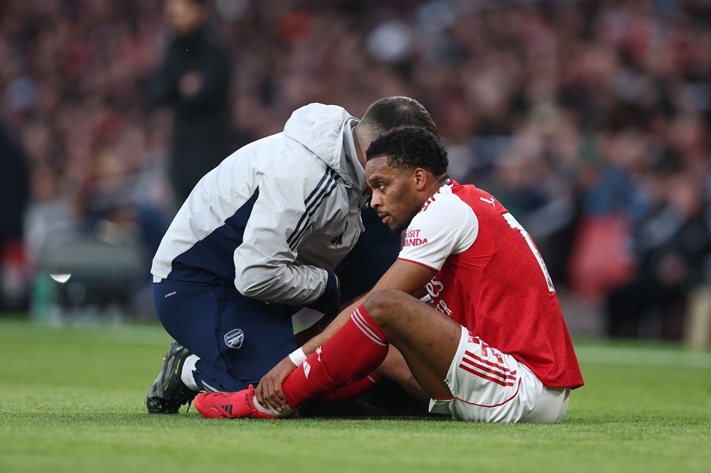 Jurrien Timber of Arsenal receives medical treatment during the Premier League match between Arsenal and Everton at Emirates Stadium on March 14, 2026 in London, England. (Photo by Alex Pantling/Getty Images)