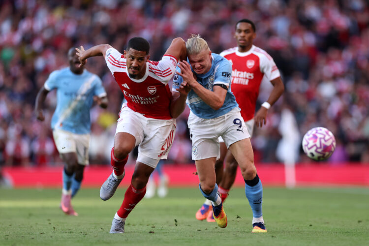 LONDON, ENGLAND - SEPTEMBER 21: William Saliba of Arsenal battles for possession with Erling Haaland of Manchester City during the Premier League m...