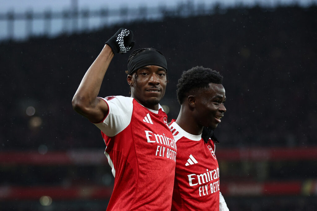 LONDON, ENGLAND - FEBRUARY 15: Noni Madueke of Arsenal celebrates with teammate Bukayo Saka after scoring his team's first goal during the Emirates FA Cup Fourth Round match between Arsenal and Wigan Athletic at the Emirates Stadium on February 15, 2026 in London, England. (Photo by James Fearn/Getty Images)