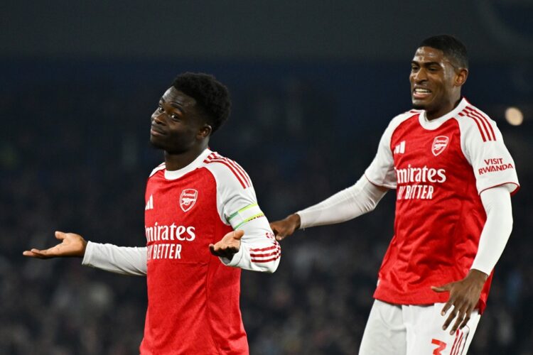 Bukayo Saka of Arsenal celebrates scoring his team's first goal with teammate Cristhian Mosquera during the Premier League match between Brighton &...