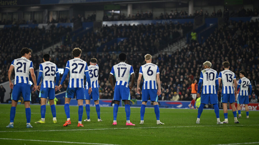 BRIGHTON, ENGLAND - MARCH 04: Olivier Boscagli, Diego Gomez, Mats Wieffer, Pascal Gross, Carlos Baleba, Jan Paul van Hecke, Georginio Rutter, Jack Hinshelwood and Ferdi Kadioglu of Brighton & Hove Albion prepare to defend a free kick during the Premier League match between Brighton & Hove Albion and Arsenal at Amex Stadium on March 04, 2026 in Brighton, England. (Photo by Mike Hewitt/Getty Images)